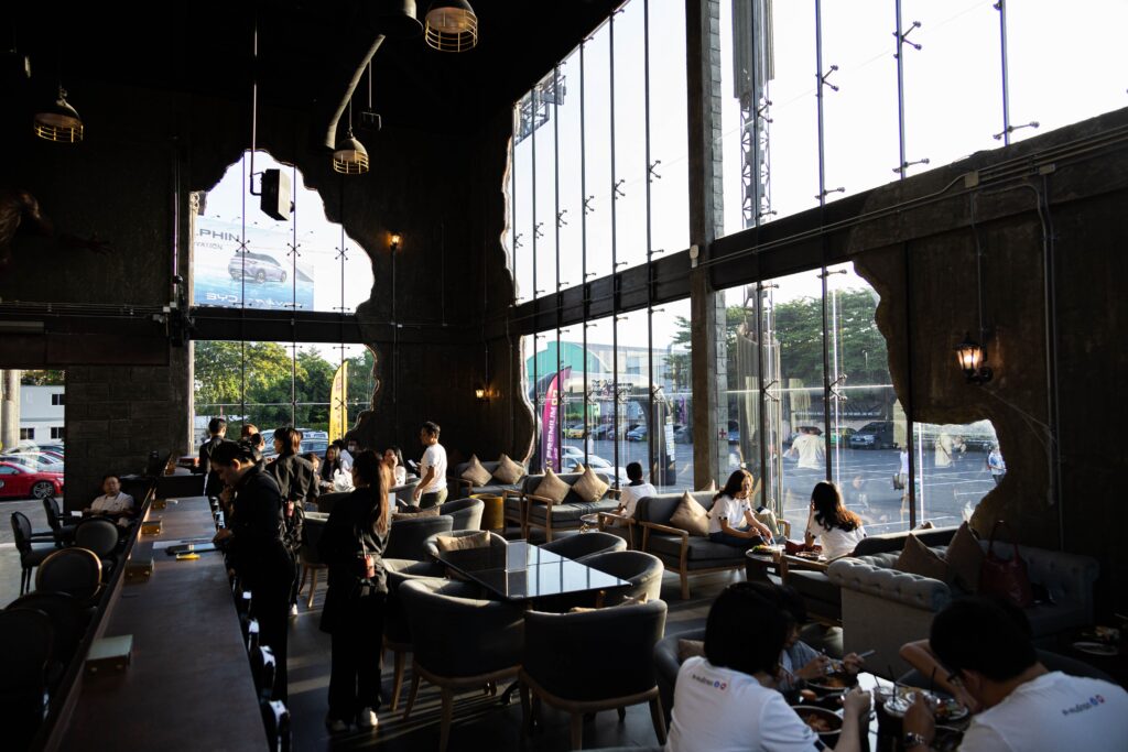 DAVIN CAFE modern event space Bangkok featuring luxury lounge seating and high glass wall atmosphere, perfect for corporate events, private gatherings, and premium celebrations in Bangkok