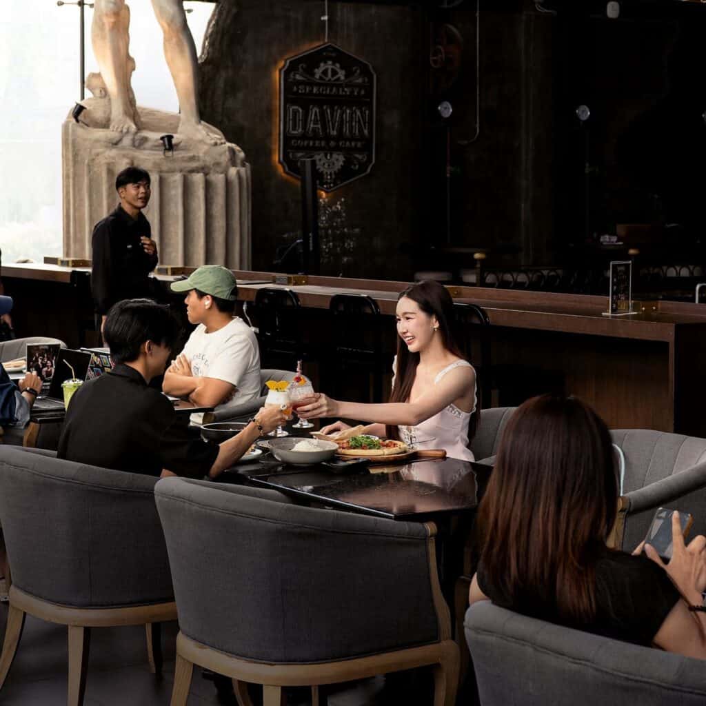 Guests enjoying food and drinks at DAVIN CAFE, a popular Bangkok restaurant for social gatherings