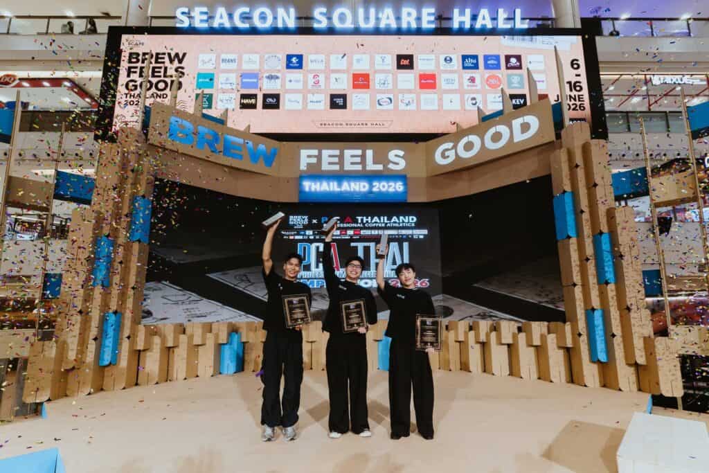 Champions of PCA Latte Art Thailand 2026 celebrating on the Brew Feels Good Thailand stage, representing national barista excellence, specialty coffee innovation, and latte art mastery, with DAVIN CAFE proudly contributing to Thailand’s competitive coffee industry