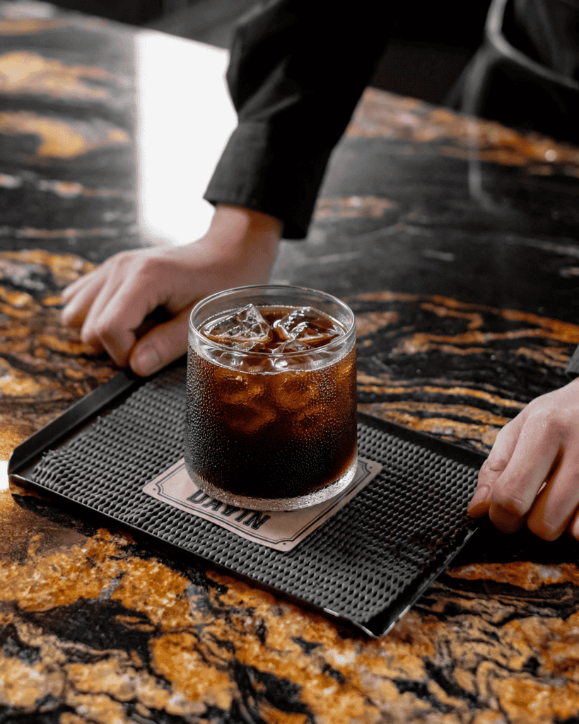 Signature Cold Brew coffee at DAVIN CAFE served over ice, showcasing a smooth flavor profile, natural sweetness, and rich coffee aroma crafted through a specialty cold brew extraction process for a premium coffee experience