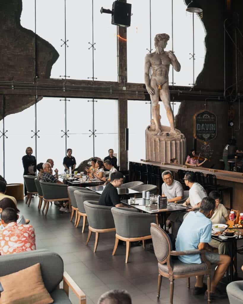 Cafe in Ramintra at DAVIN CAFE featuring a spacious seating area with comfortable spaces and European-inspired interior design