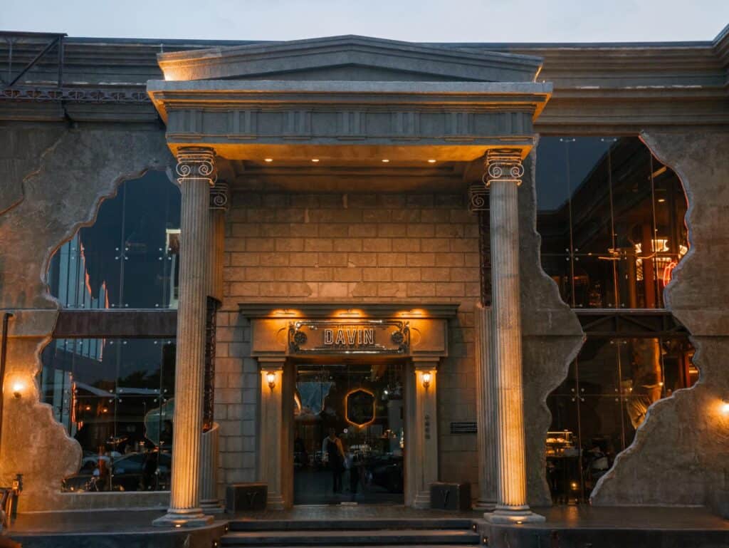 DAVIN CAFE European-style facade with Roman columns and warm evening lighting, a Golden Hour Cafe in Ramintra